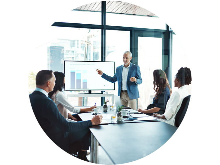 A senior employee heading the discussion with the employees in the conference room