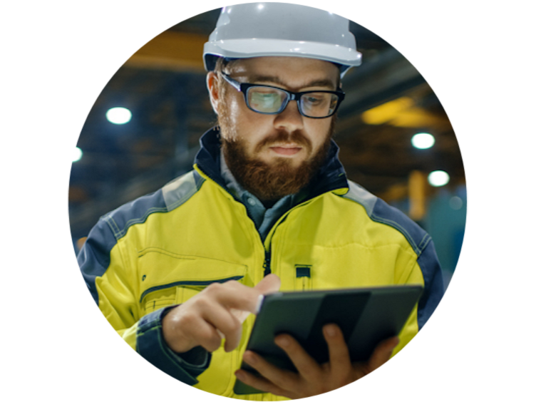Close-up of a worker looking at the data on his tab