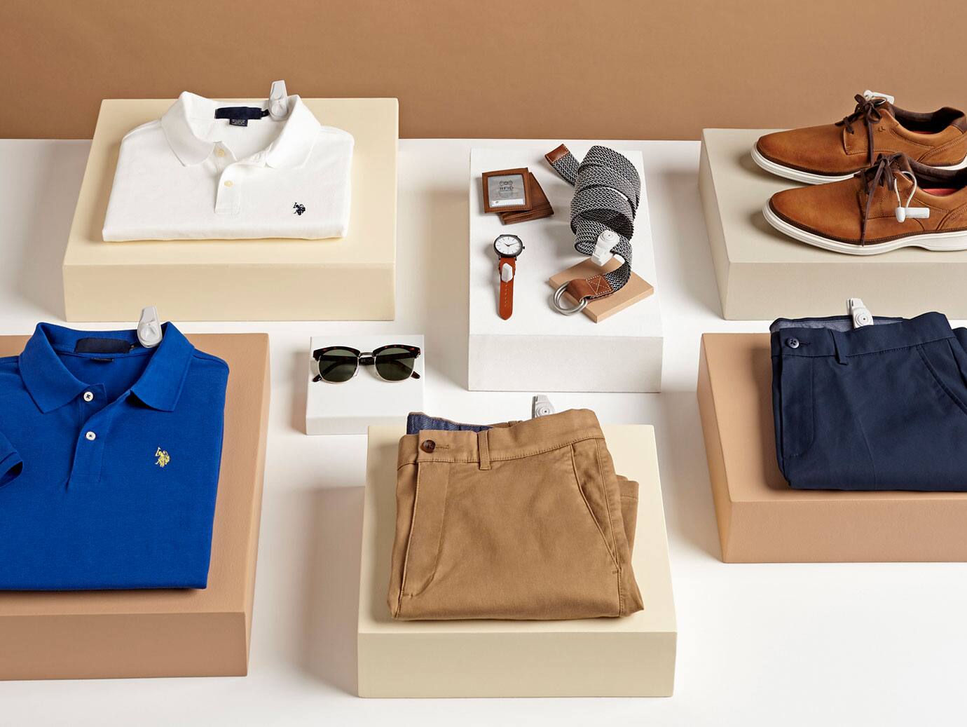 A selection of men's clothing items neatly displayed on a table