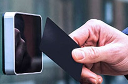 A man swiping an electronic card