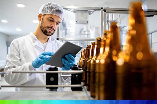 Quality control expert making notes at the manufacturing plant