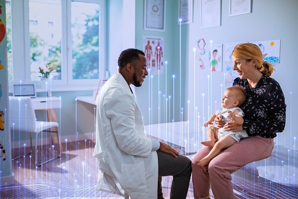 A doctor having the conversation with the mother and the baby in the clinic