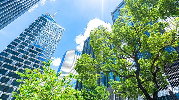 A group of tall buildings with trees